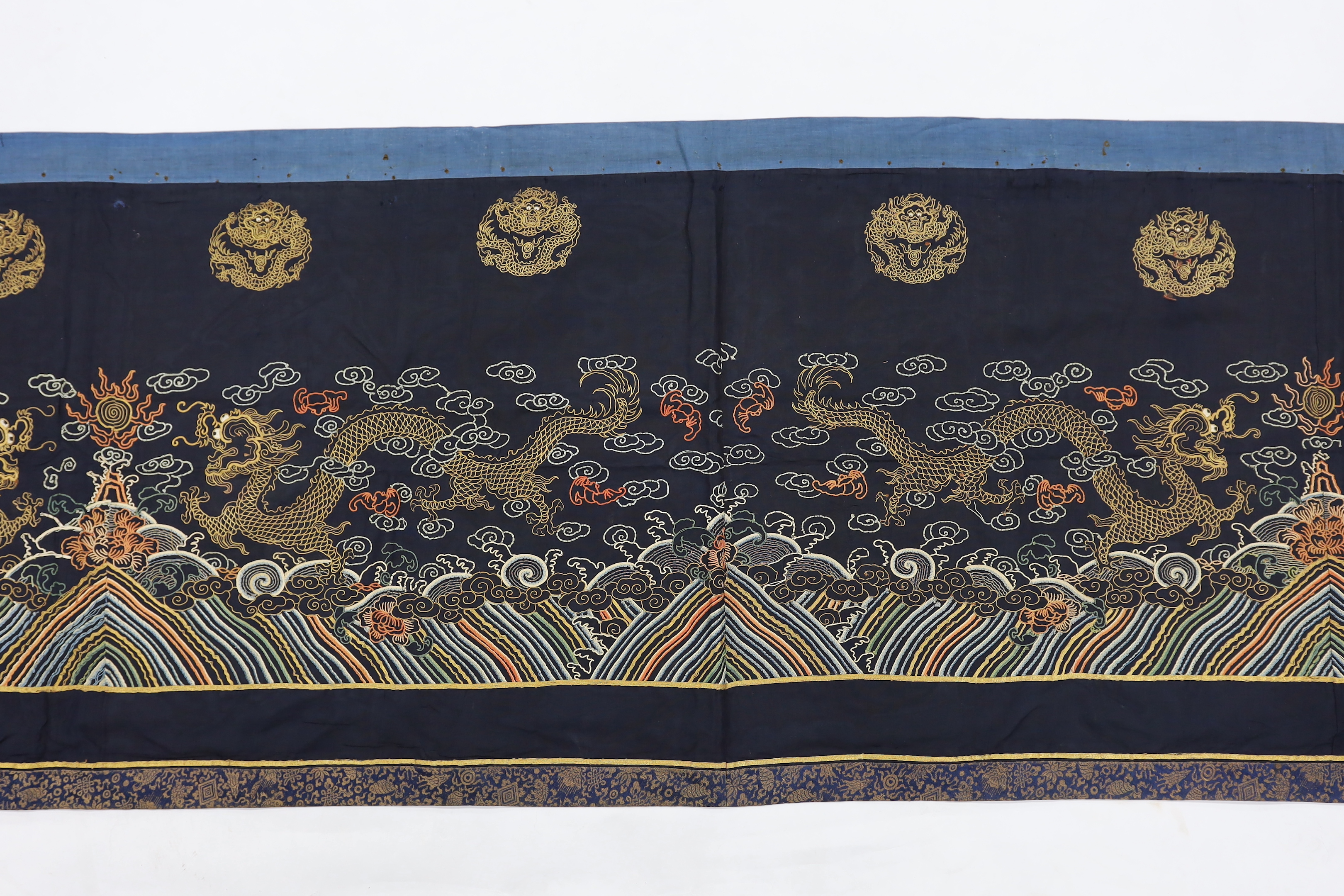 A Chinese long gauze gold dragon and multi-coloured embroidered altar cloth, with brocade borders, 290cm long x 78cm high